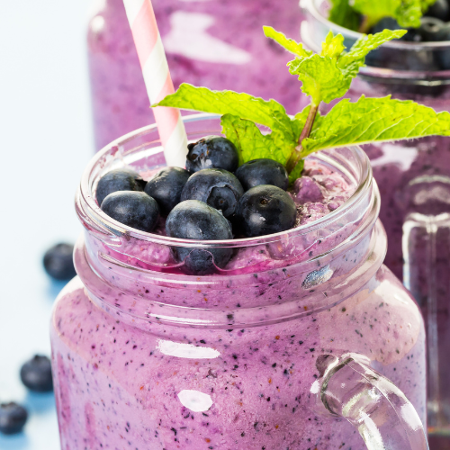 Blueberry Fruit Smoothie with a straw