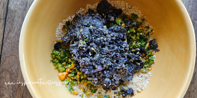 Black bean and veggie mixture in a bowl with oats.