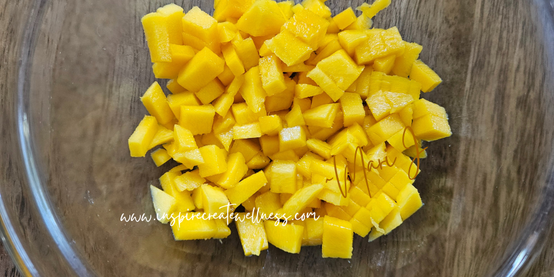 Chopped Organic Mango in a glass bowl