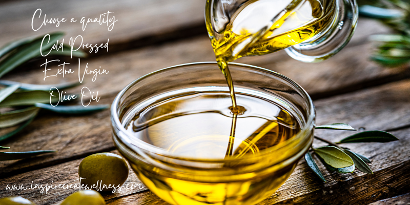 Cold pressed extra virgin olive oil being poured into a bowl