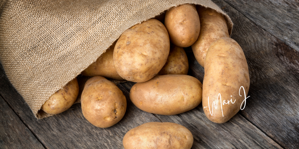 Russet potatoes poured out of a bag