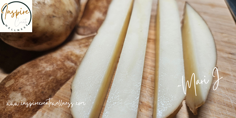 Thick cut organic potatoes on a cutting board