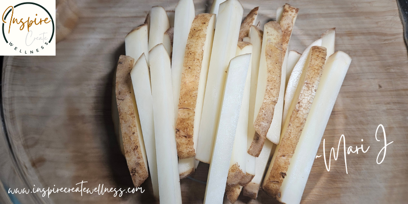 Naturally cut russet potato fries in a glass bowl