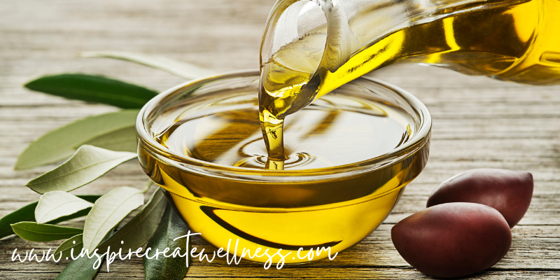 Olive Oil being poured into a glass bowl