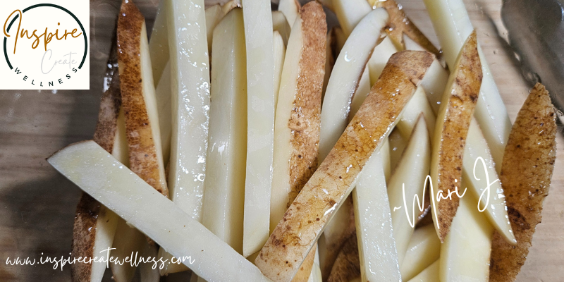 Cut russet potatoes covered with olive oil