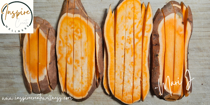 Sweet Potatoes sliced into fries on a cutting board