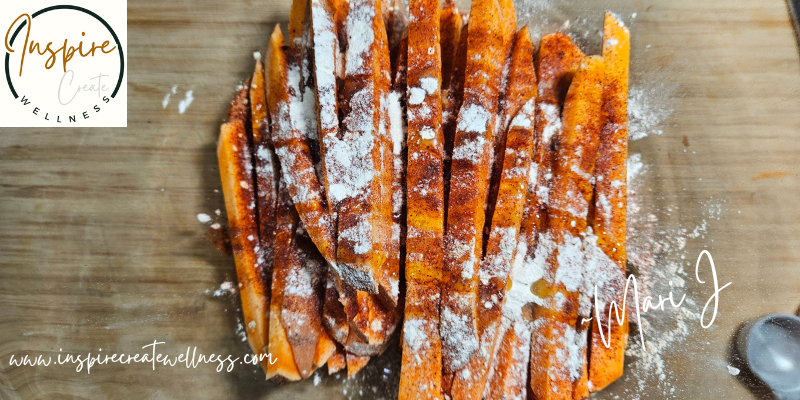 Freshly cut sweet potato fries sprinkled with spiced and olive oil