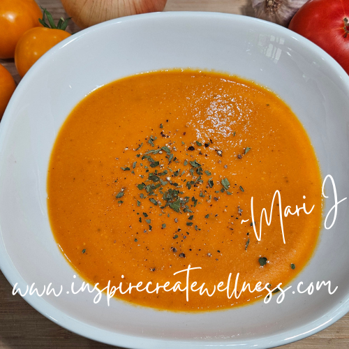 Creamy Roasted Tomato Soup in a white bowl for recipe