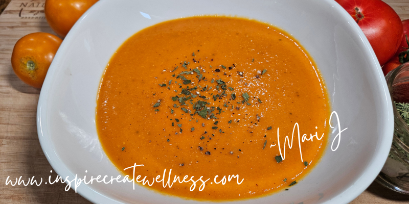 Creamy Roasted Tomato Soup in a white bowl ready to serve