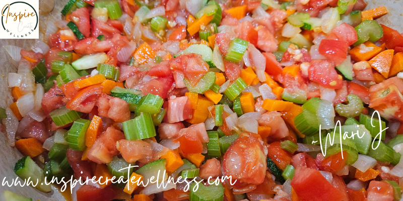 Chopped organic tomatoes, celery, carrots, and onions. Ingredients needed for Hearty Homemade Minestrone Soup