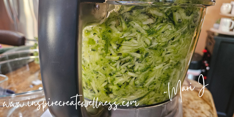 Shredded zucchini in a food processor