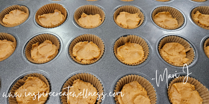 Mini muffin tray with liners and peanut butter filling for Dark Chocolate Peanut Butter Cups