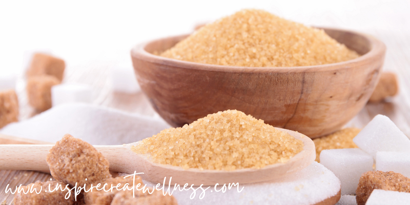 Organic Cane Sugar in a bowl and spoon. The sugar battle