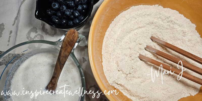 Blueberry Kefir Pancakes wet and dry ingredients in bowls and blueberries