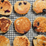 Blueberry Kefir Pancakes on a cooling rack.