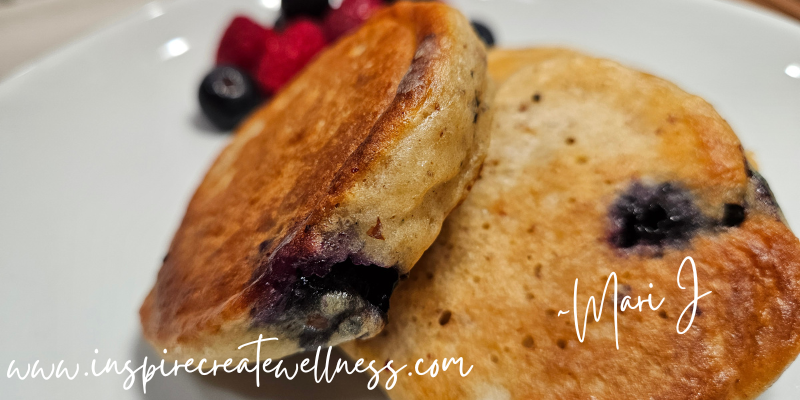 Amazing Blueberry Kefir Pancakes on a white plate with fresh berries