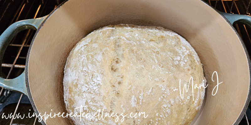 Easy Honey Oat Bread in a Dutch Oven baking in a hot oven.